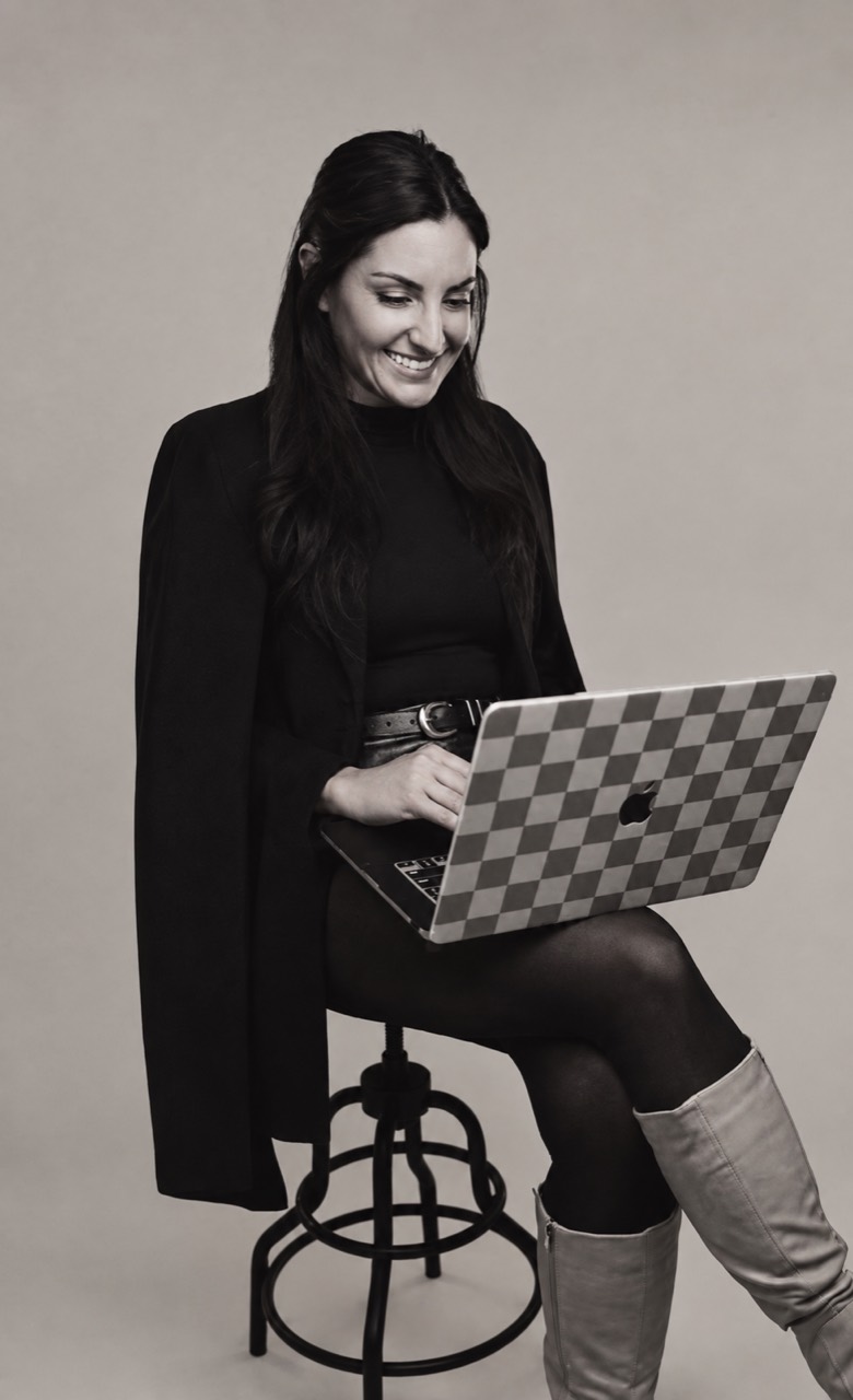 Kelsey Phillips seated at a laptop